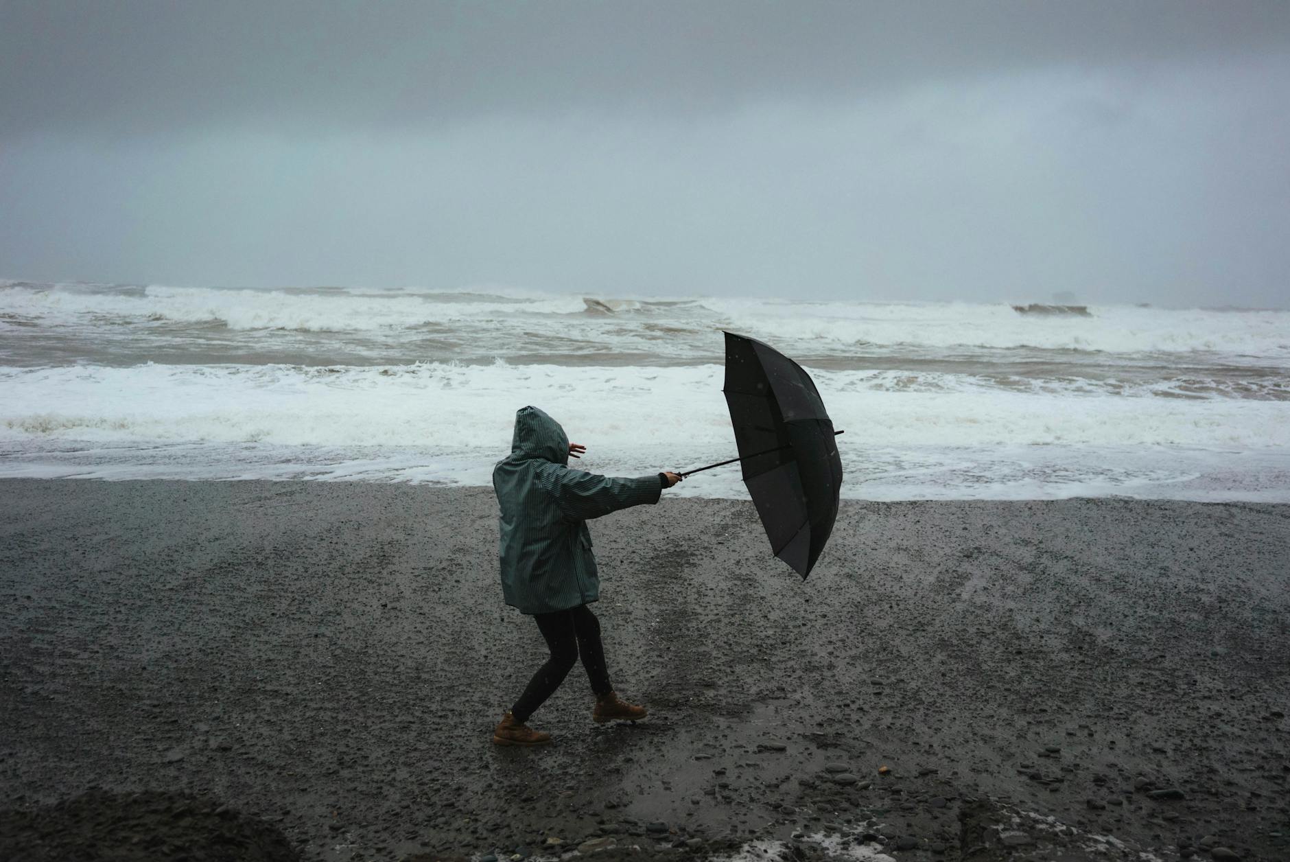 Walking on the Beach in a Storm. Photo by Dziana Hasanbekava on Pexels.com